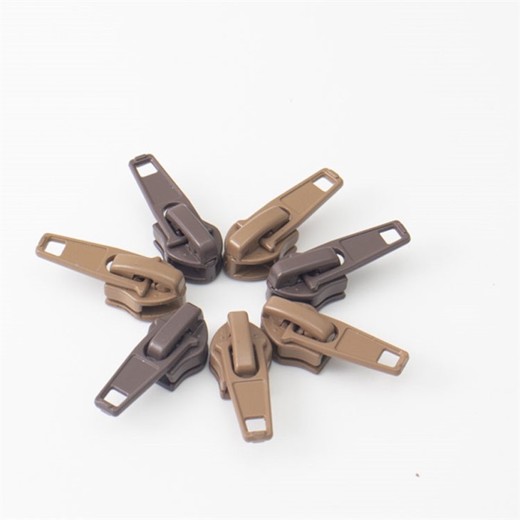 Neilona spoles rāvējslēdzēja slīdnis